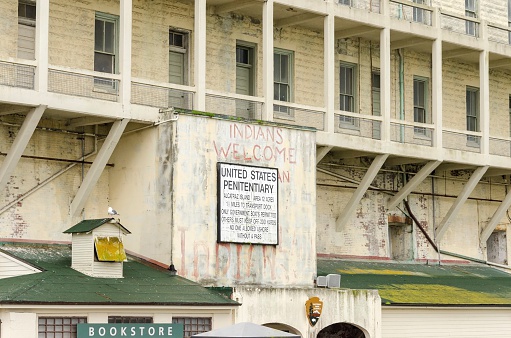 San Francisco, California, United States of America - February 28, 2014: The old sign on Alcatraz Penitentiary island, now a museum, in San Francisco, California, USA, which was painted with red graffiti by Indians during the native American occupation.