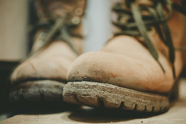 istock Old and Dirty boots in mud 509426784