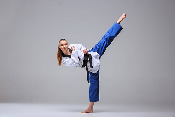 istock Karate girl with black belt 509428492