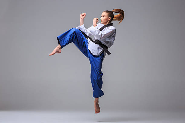 istock The karate girl with black belt 509429090