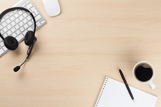 istock Office desk with headset. Call center support 509430970