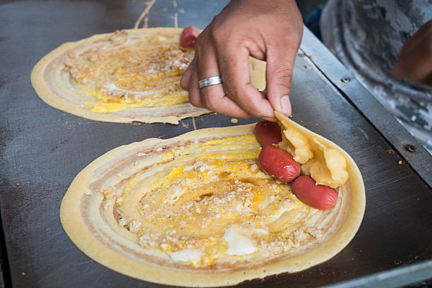 istock Seller rolling Khanom Tokyo Thai street snack 509431580