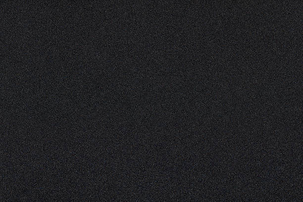 istock Dark black background with shiny color speckles 509433054