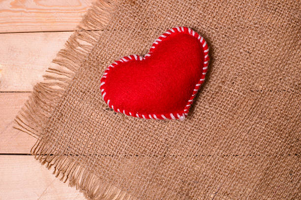 istock Textile heart on fabric texture of burlap 509433202
