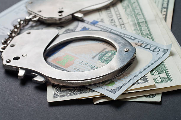 istock Handcuff and dollars 509433966