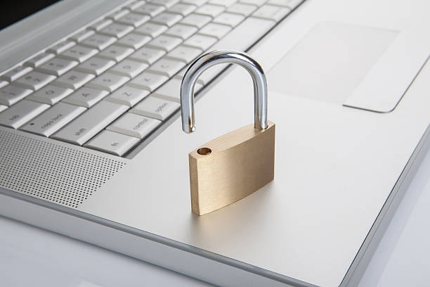istock Unlock padlock standing on laptop 509434812