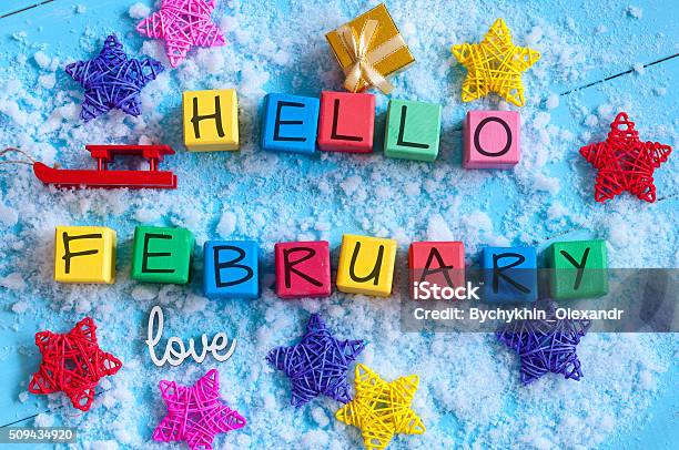 Writing Hello February On Toy Wooden Colour Cubes With Decor Stock Photo - Download Image Now