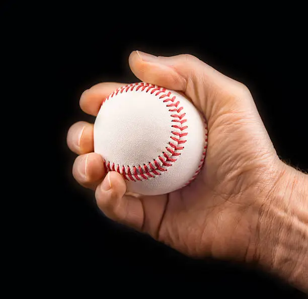 Photo of Man's hand with a baseball ball