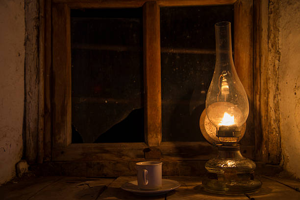 istock Vintage kerosene lamp at window 509436094