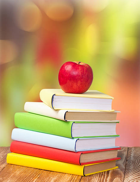 istock Back to school september holiday background stack books apple. 509436586