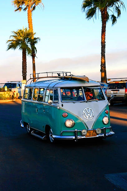 Volkswagon 1966 type-2 (T1) Kombi Santa Barbara, CA, USA - July 4,, 2015: A 1966 Volkswagon type-2 (T1) Kombi seen in Santa Barbara, California with a surfboard on the roof car transporter stock pictures, royalty-free photos & images