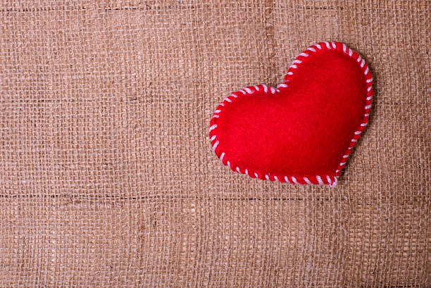 istock Textile heart on fabric texture of burlap 509437718