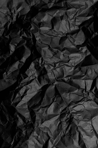 istock Crumpled black paper 509438458
