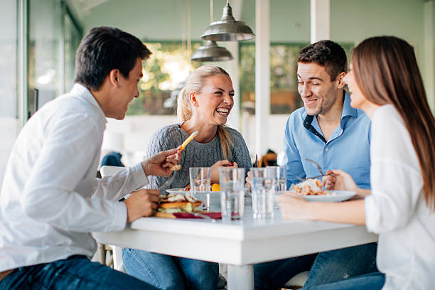 istock Friends Enjoying Lunch In Restaurant 509438512