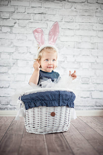 istock Cute baby bunny in the basket 509441743