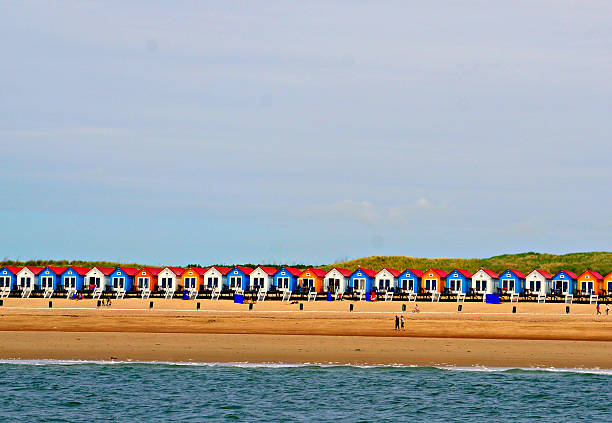 istock Colored blue, yellow and white houses on the beach 509442847