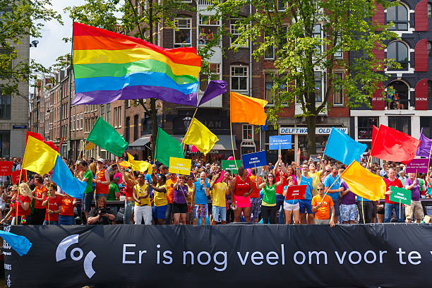 - coc nederland-boot in amsterdam canal parade 2014 - city amsterdam urban scene gay parade stock-fotos und bilder