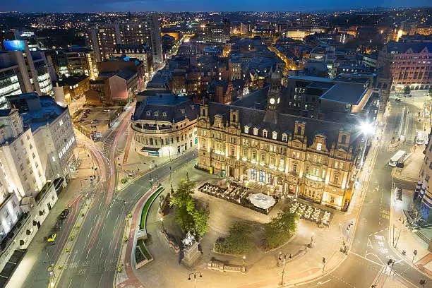 Restaurants and bars in the former post office building Leeds City Square at night - Leeds West Yorkshire.