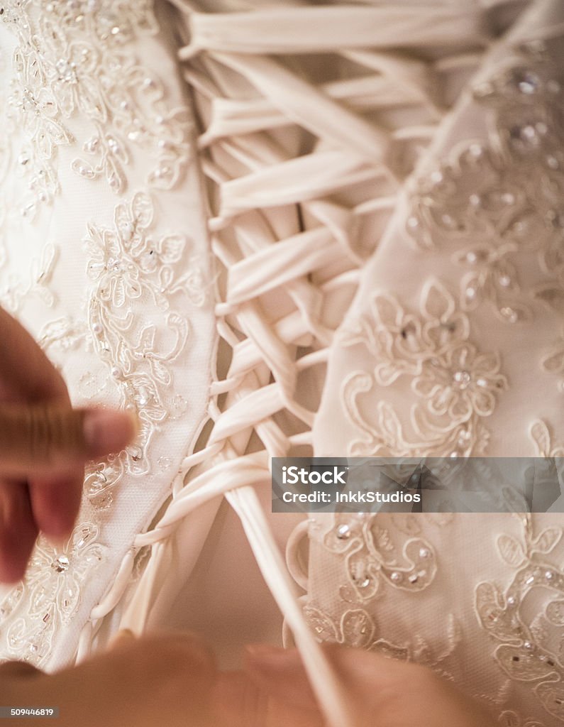 Wedding Day Tying a Corset Backgrounds Stock Photo