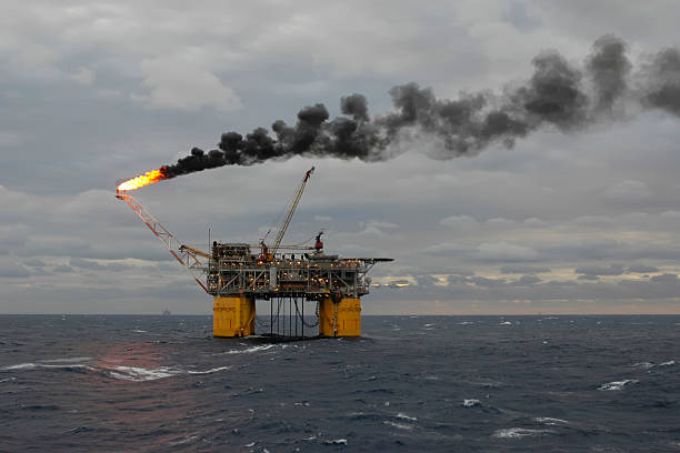 Offshore production platform flaring off gas. stock photo