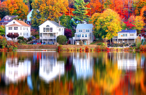 Beautiful autumn reflection on a small pond in Boston's Brighton neighborhood. Boston is the largest city in New England, the capital of the state of Massachusetts. Boston is known for its central role in American history,world-class educational institutions, cultural facilities, and champion sports franchises.