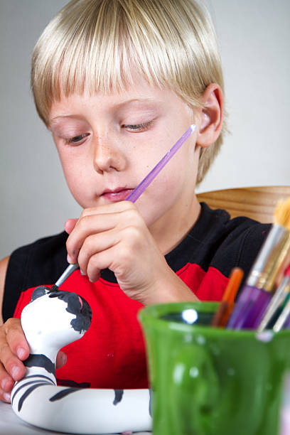istock Caucasian Blond Little Boy Painting Pottery 509448659