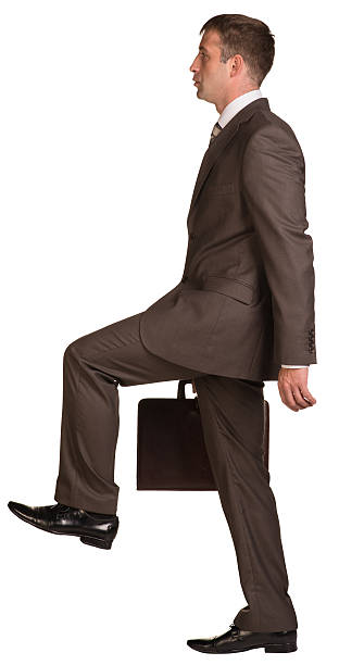 istock Walking businessman with briefcase 509464493