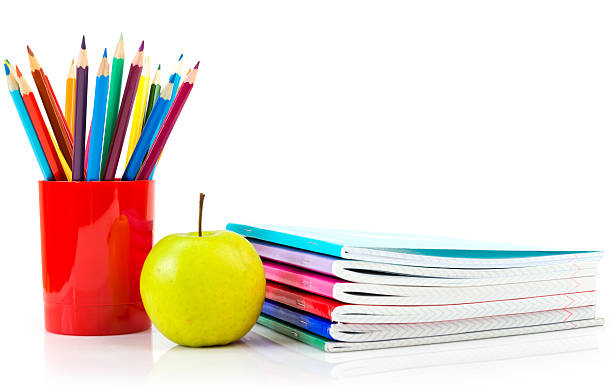 notebooks, pencils and apple. Back to school concept.