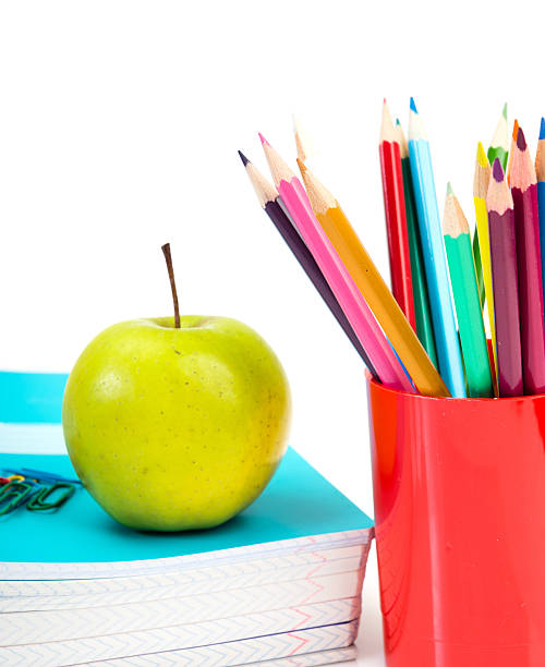 istock notebooks, pencils and apple. Back to school concept. 509465823