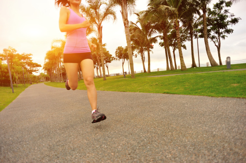 healthy lifestyle fitness asian woman jogging at seaside tropical park