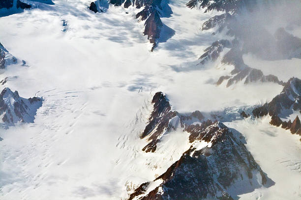 Aerial view of the antarctica with glaciers, mountain, snow and river