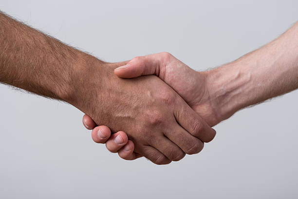 istock Close-up of people shaking hands 509468804
