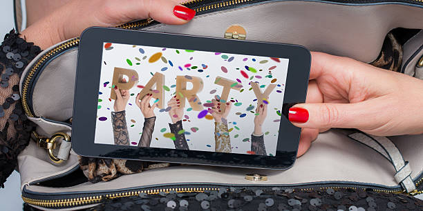 istock tablet purse with Party invite and clipping path 509468898
