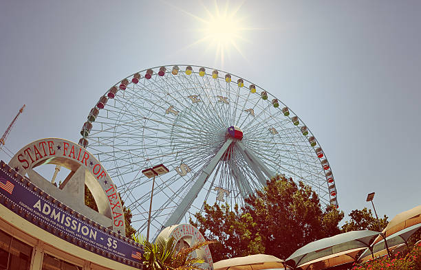 Dallas, USA - July 6, 2014: Texas Star, the largest ferris wheel in North America, rises above the horizon at Fair Park in Dallas, Texas.