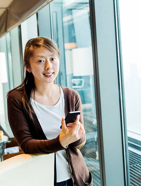 istock Young asian woman using smart phone 509469414