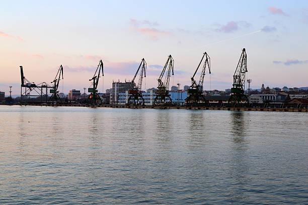 istock Cargo docks with dark cranes’ silhouettes after sunset 509469550