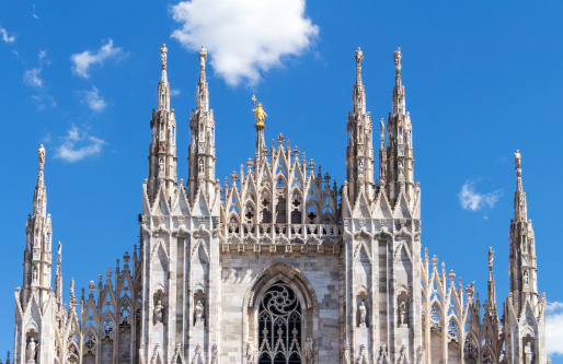 Golden statue of Madonnina (Virgin Mary) in the center.