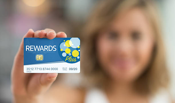 istock Woman holding a rewards card 509470972