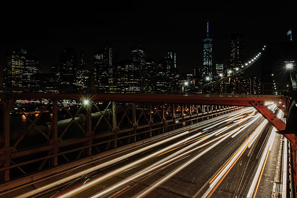Cars speeding on the Brooklyn Bridge, Manhattan stock photo