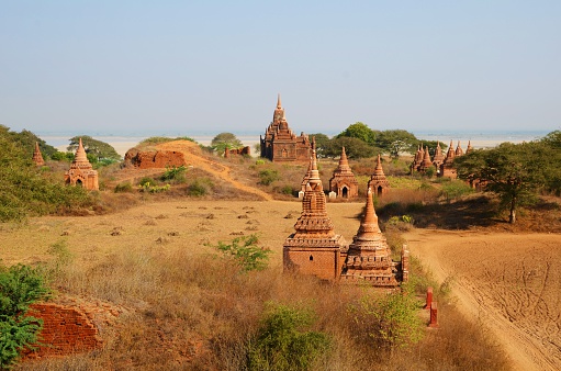 Several ancient temples on a field in Bagan, Myanmar
