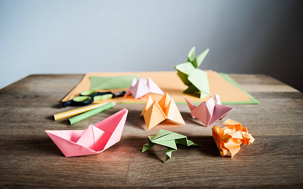 istock Origami figurines on a table. 509475516