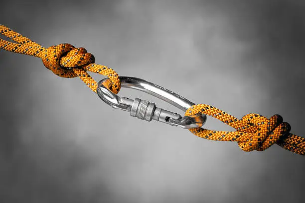 Image of a carabiner hook with a climbing rope