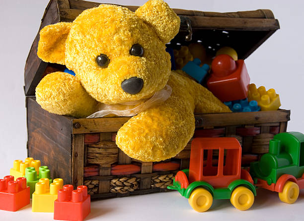 istock Teddy bear and toys in small suitcase 509476592