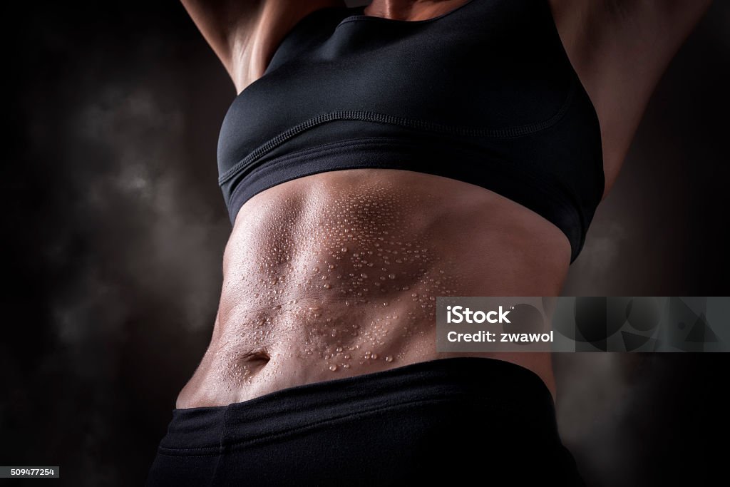 Trained belly middle aged woman Picture of a trained belly of a middle aged woman over 45 years Abdominal Muscle Stock Photo