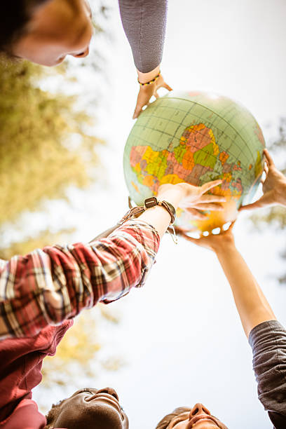 istock teenagers college student smiling with globe 509479314
