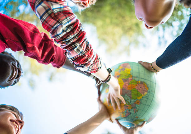 istock teenagers college student smiling with globe 509479528