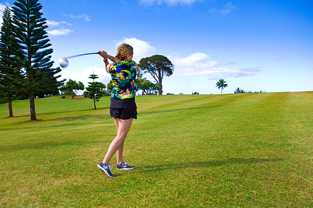 istock Woman Golfer Golfing in a Golf Course in Kauai, Hawaii 509479854