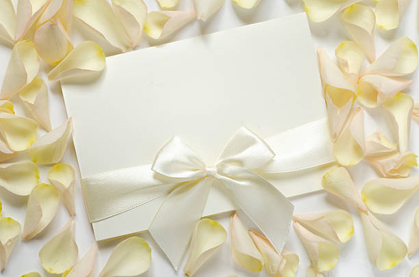 istock card with ribbon and rose petals 509480812