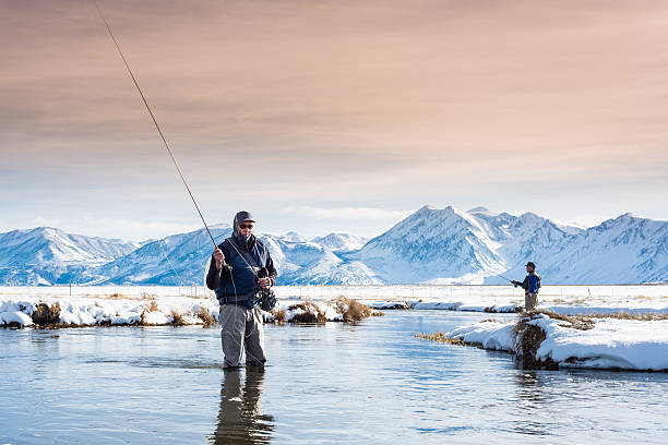 istock Two Fly Fisherman In The River During Winter 509481060