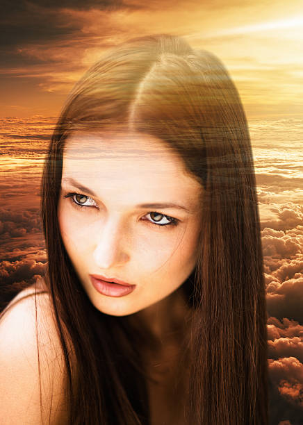 istock pretty woman looking away on the clouds 509481174